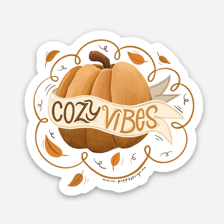 Klistremerke med gresskar og teksten cozy vibes